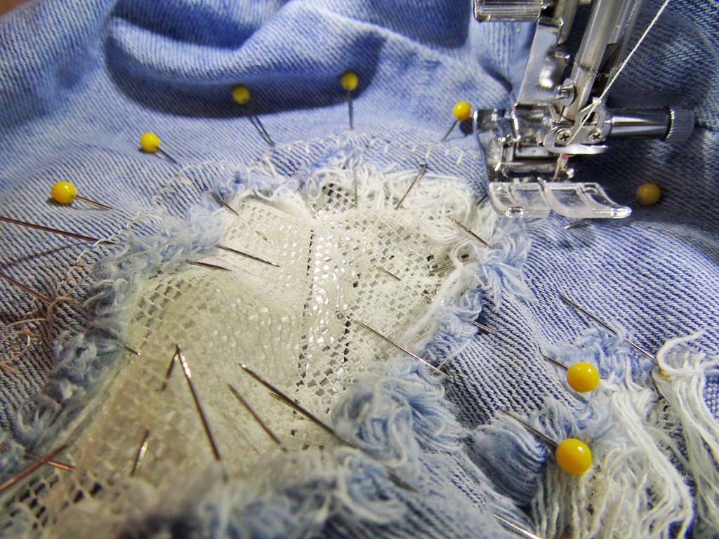 Machine stitch a patch, visible mending